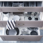 Set of clean kitchenware in drawers